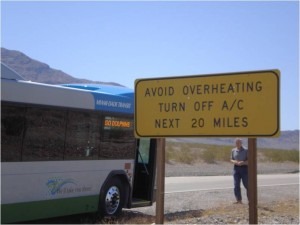 Death Valley climate testing, sign reads avoid over-heating, turn off a/c, next 20 miles